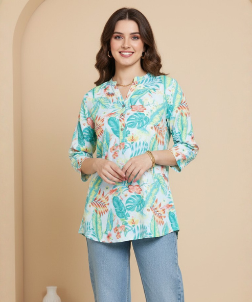 Woman wearing mint green tropical floral print tunic with mandarin collar and three-quarter sleeves